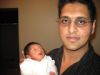 Proud dad holding up Sohan
