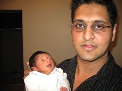 Proud dad holding up Sohan